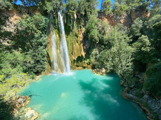 Swim in the turquoise water beneath Sillands-la-Cascade