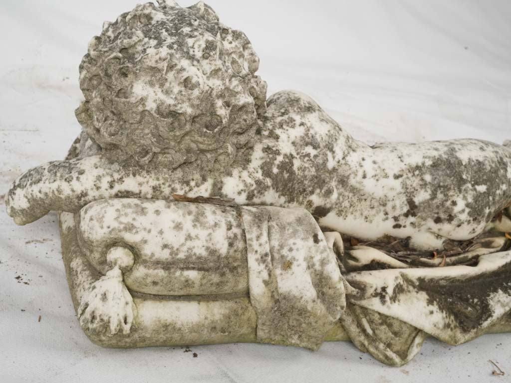 Vintage weathered cherub garden figurine