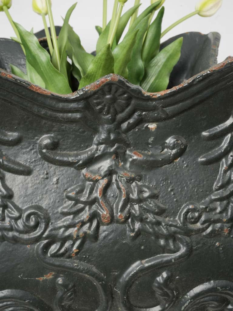 Antique foliate-adorned planters