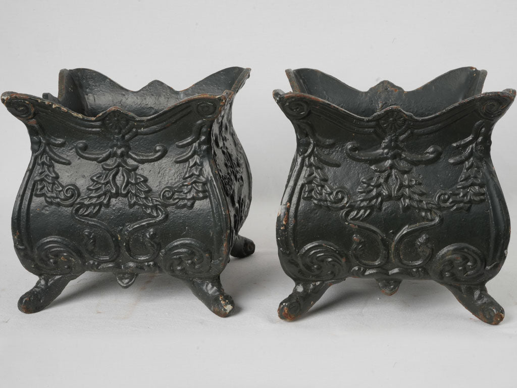 Intricate scrollwork cast-iron planters