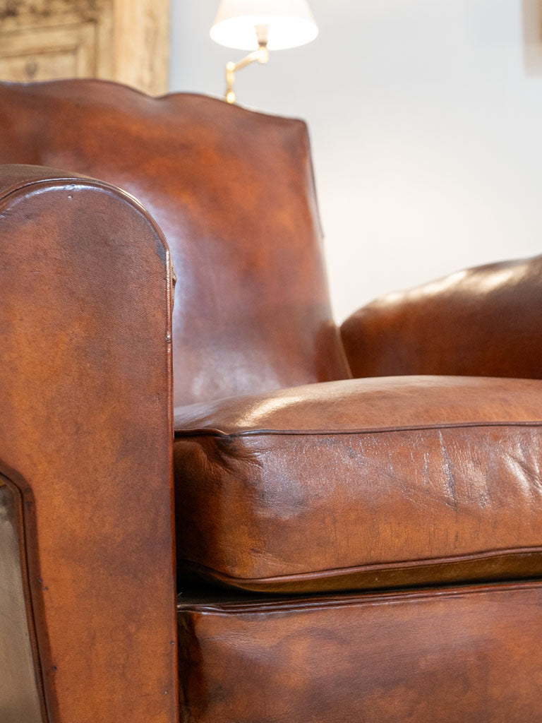 Pair of antique French leather club chairs - moustache back