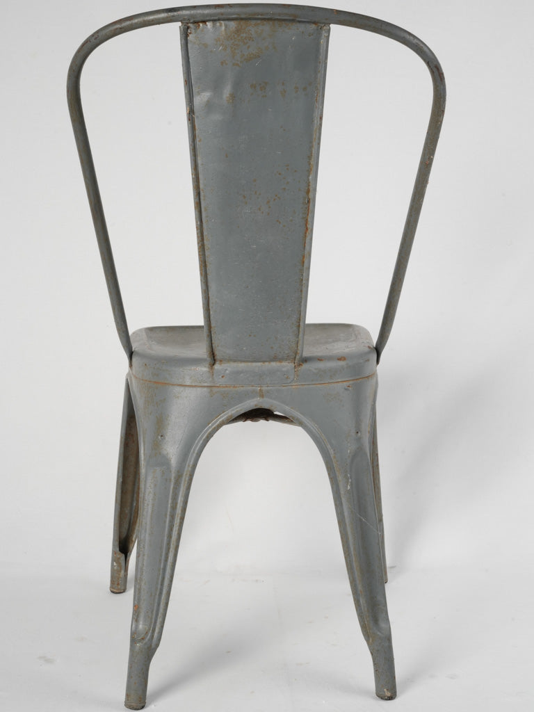 Elegant aged steel dining chair