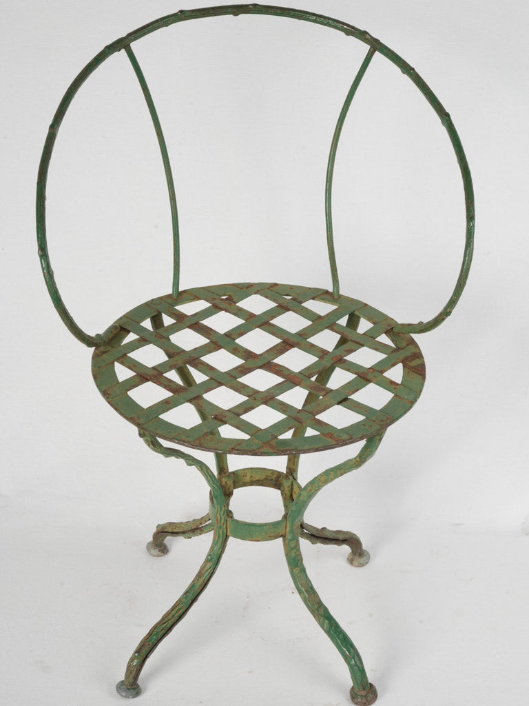 Weathered green iron garden seat