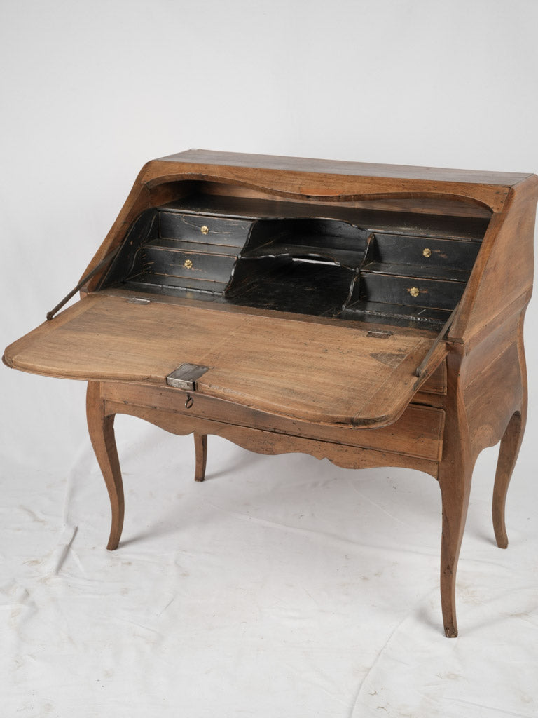 Graceful antique curved walnut bureau