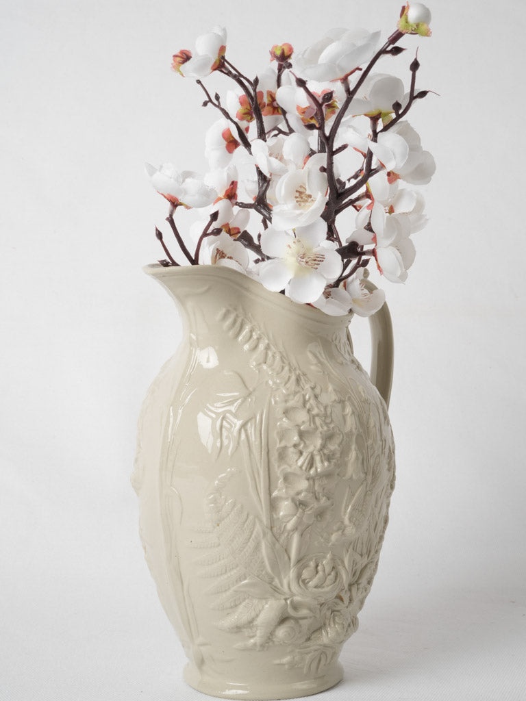 French nature-inspired embossed ceramic vessel