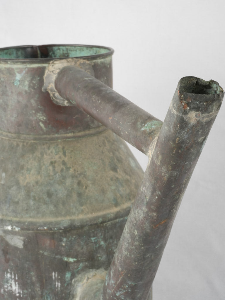 Aged copper vine-treating watering can