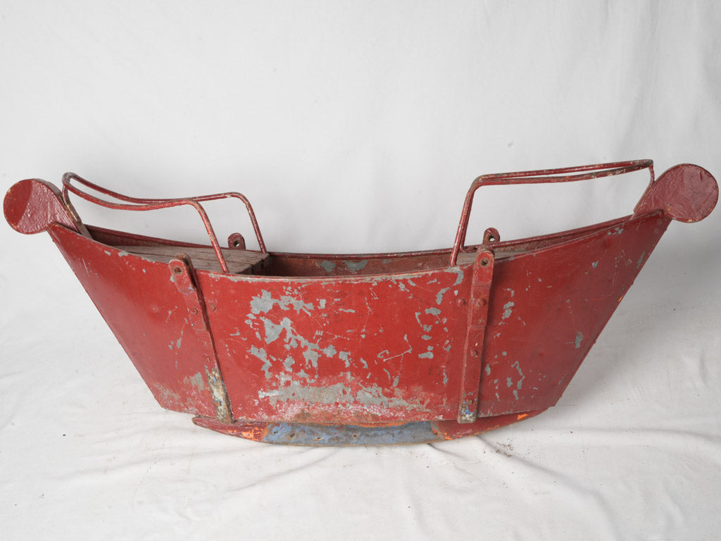 Whimsical red metal boat basket