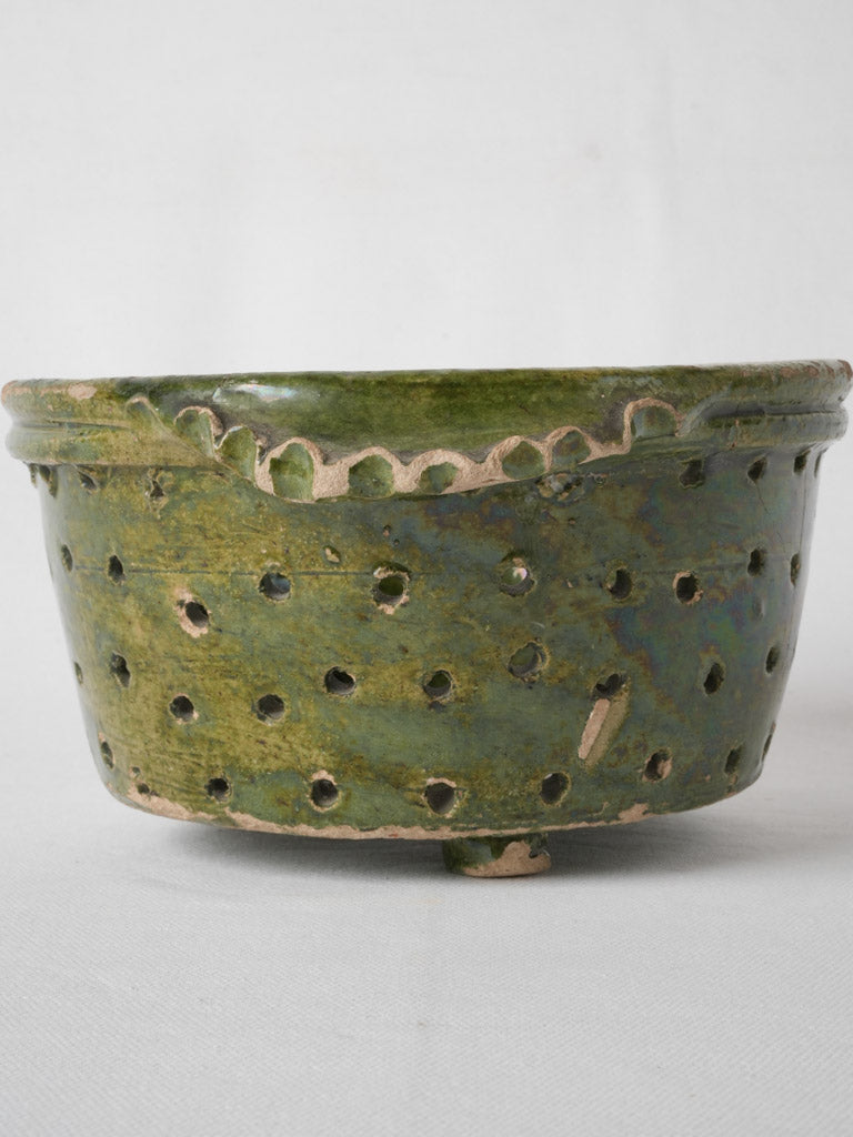 Perforated, footed, antique green-glazed terracotta pot