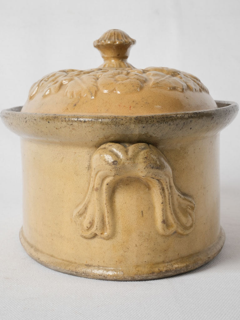 Ornate custard yellow terracotta tureen