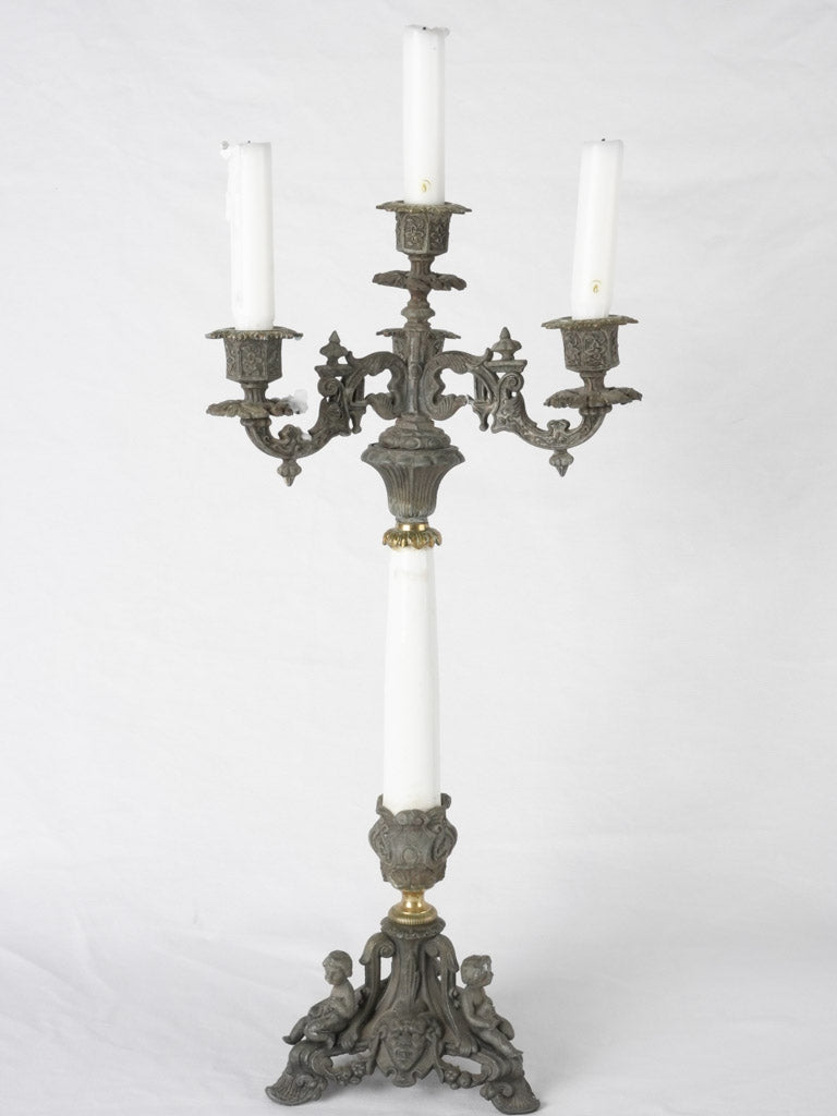 Ornate regule twin-battery candelabras