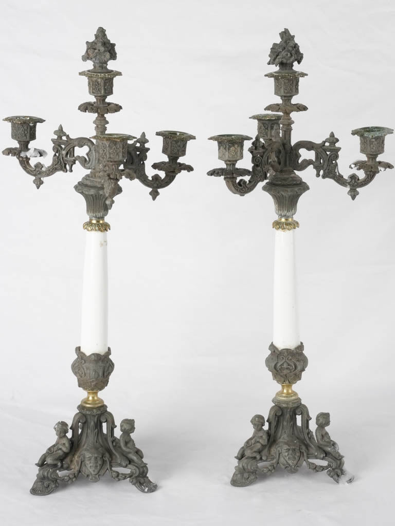 Victorian-era cherub embellished candelabras