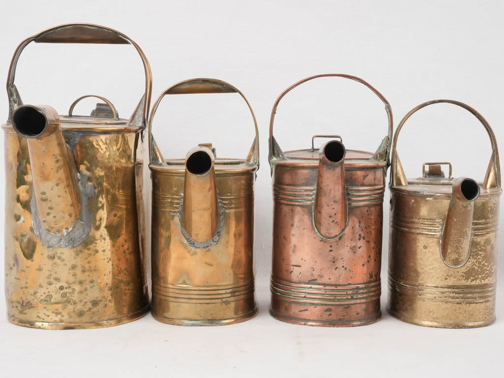 Traditional weathered copper watering cans