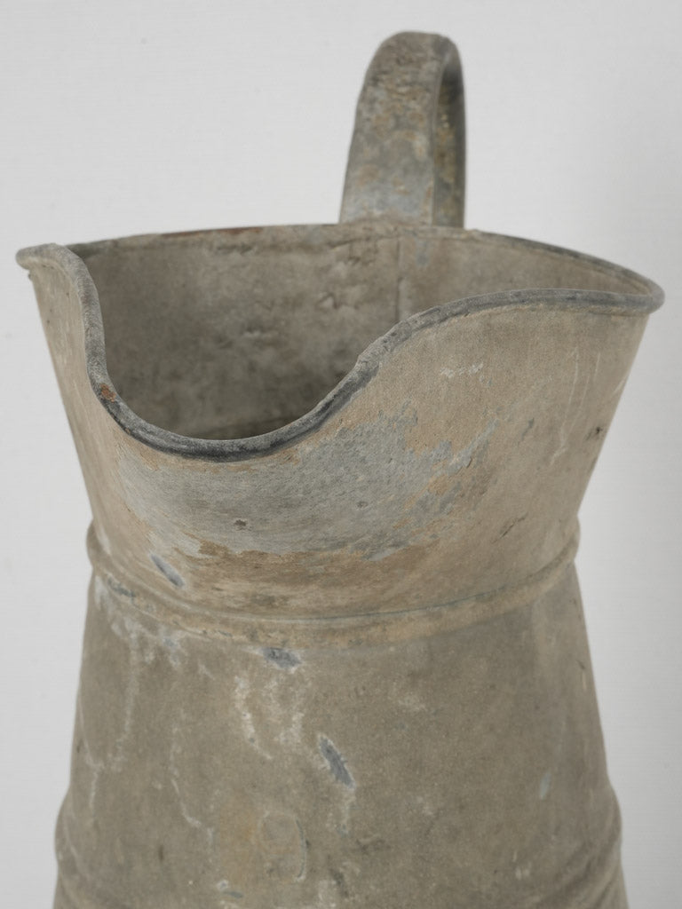 Elegant timeworn zinc pitcher