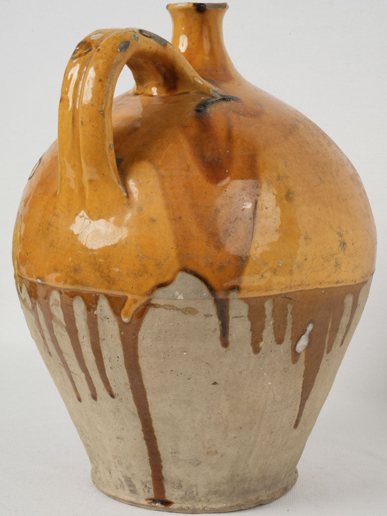 Aged yellow ocher glazed pottery