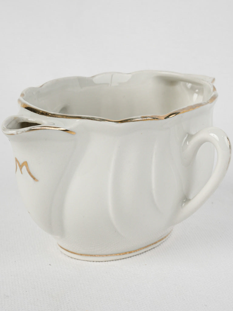 Luxurious, aged porcelain gravy boat