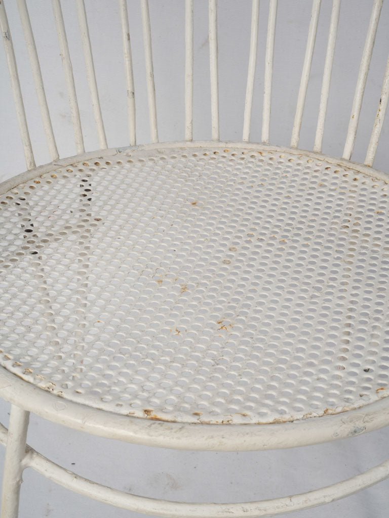 Aged white iron garden chairs