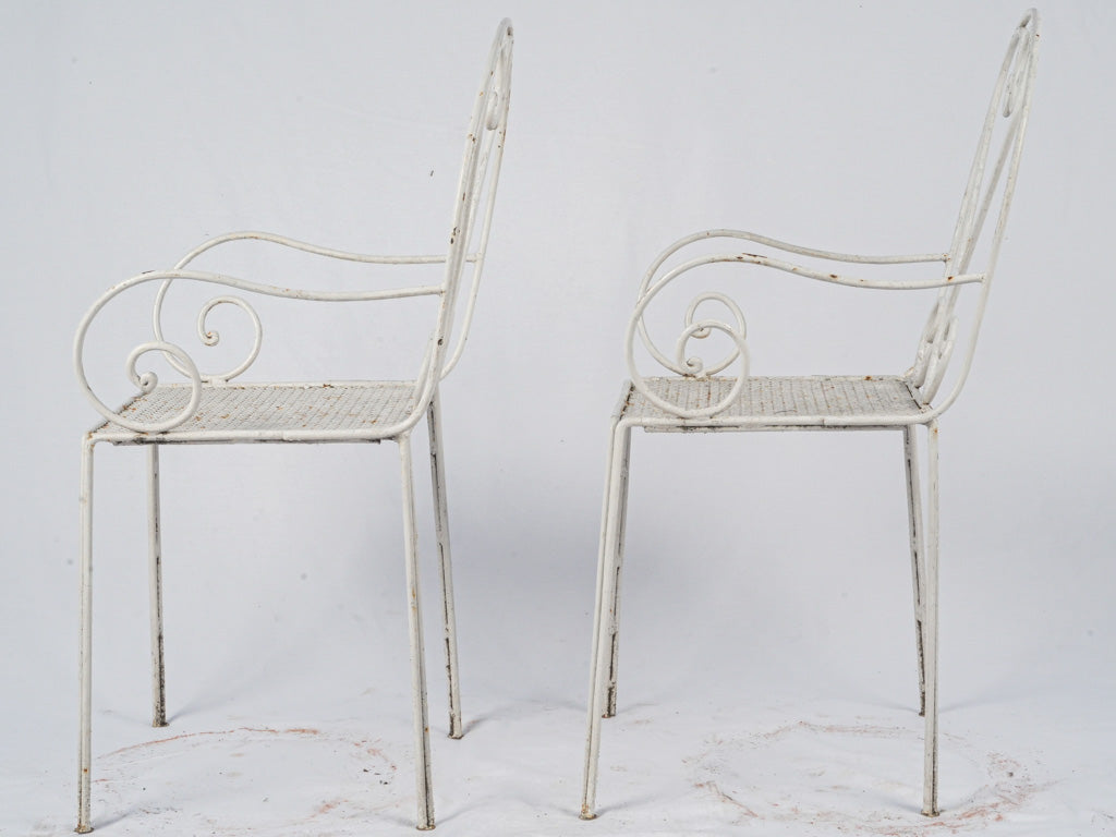 Weathered white wrought iron patio set