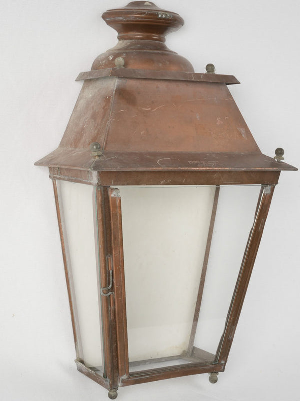 Antique glass-paneled outdoor light fixture