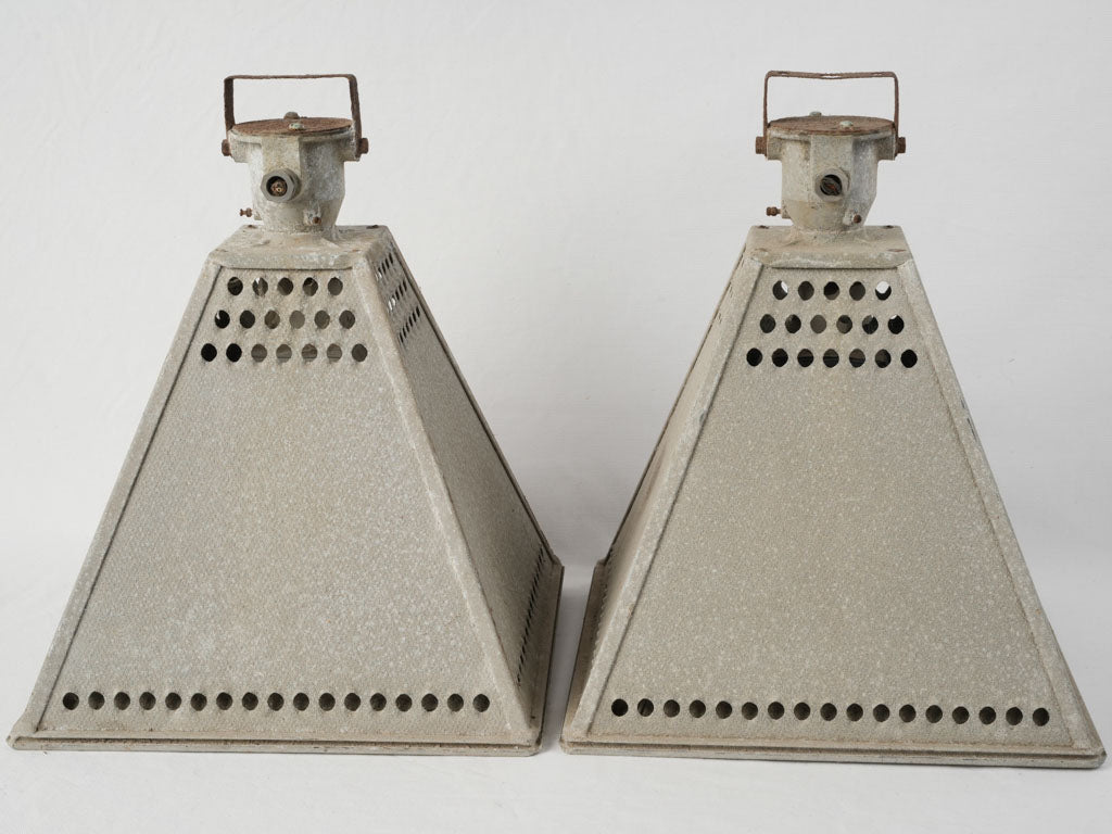 Weathered steel pyramid pendant lamps