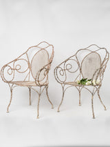 Ornate, antique French wrought iron armchairs