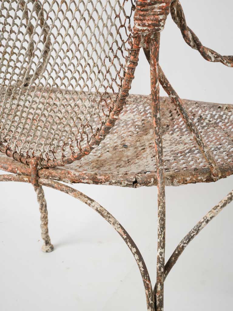 Wrought iron, weathered mesh outdoor chairs