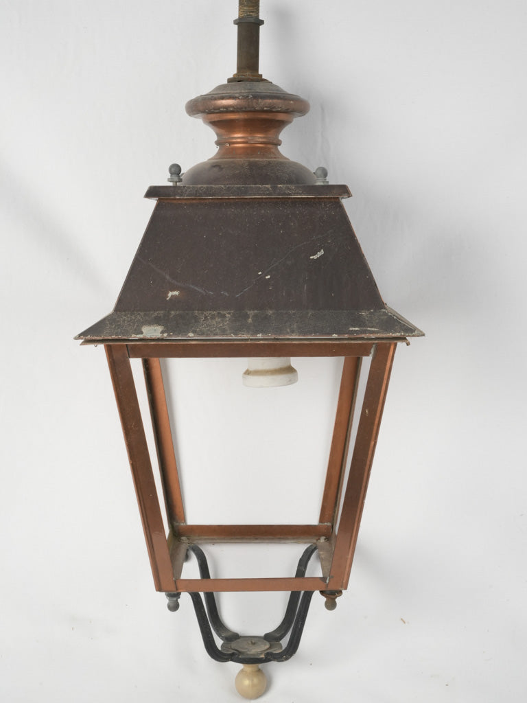 Antique street lantern with warm patina