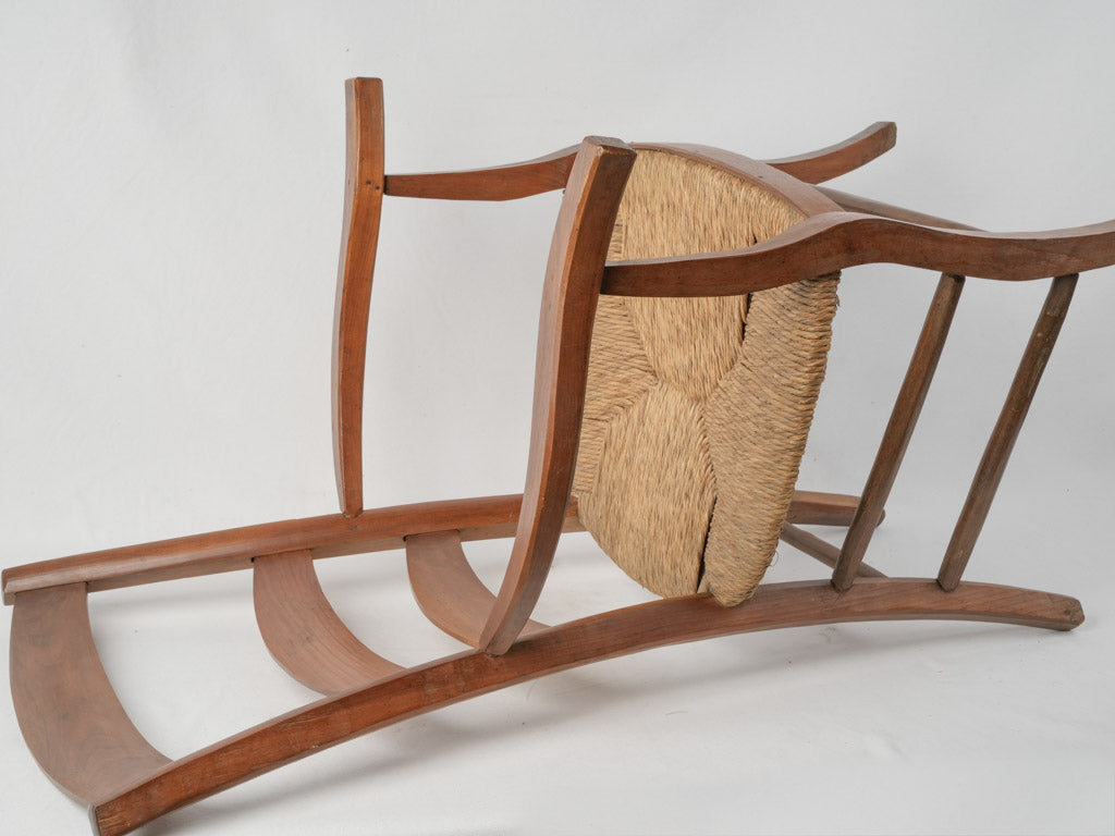 Weathered rush seat armchair