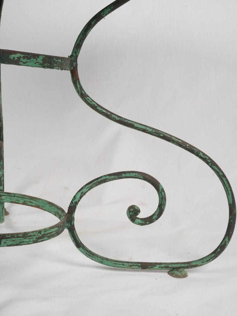 Graciously aged wrought iron bistro furniture