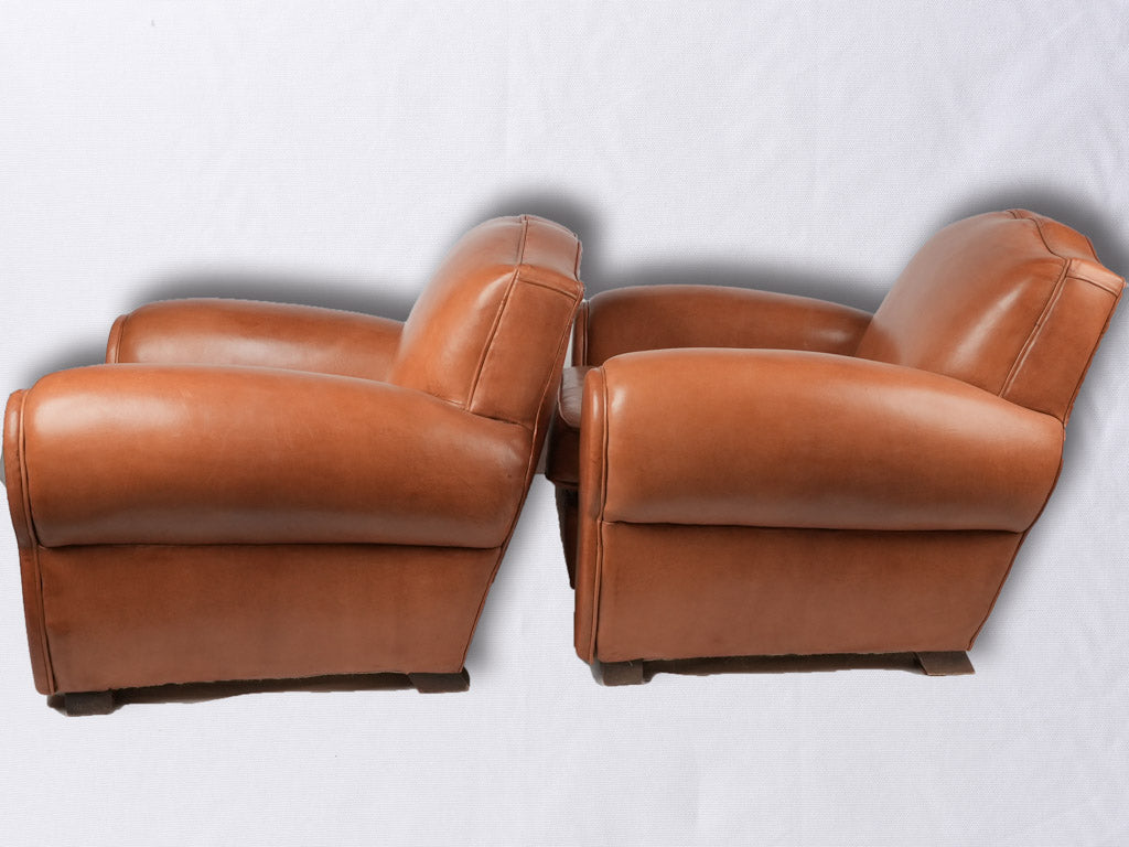 Pair of French leather club chairs - Moustache back