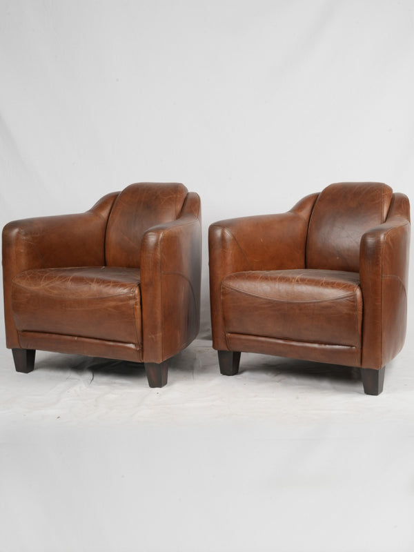 Vintage chocolate-brown leather club chairs