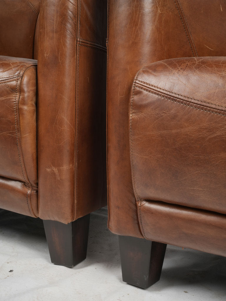 Distinctive French chocolate-brown armchairs