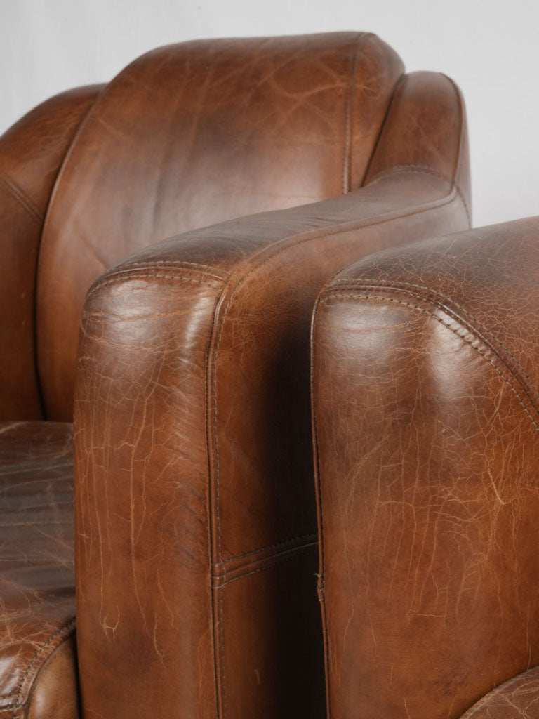 Aged brown leather sitting chairs