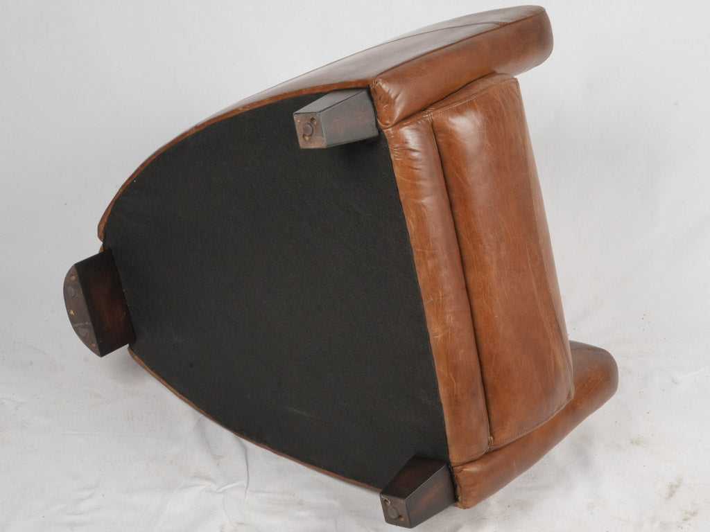 Timeless aged leather lounge chairs