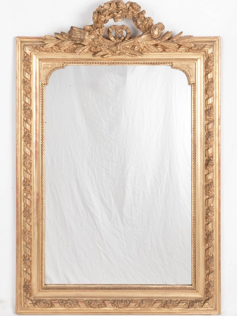 Antique gilded Louis XVI-style mirror