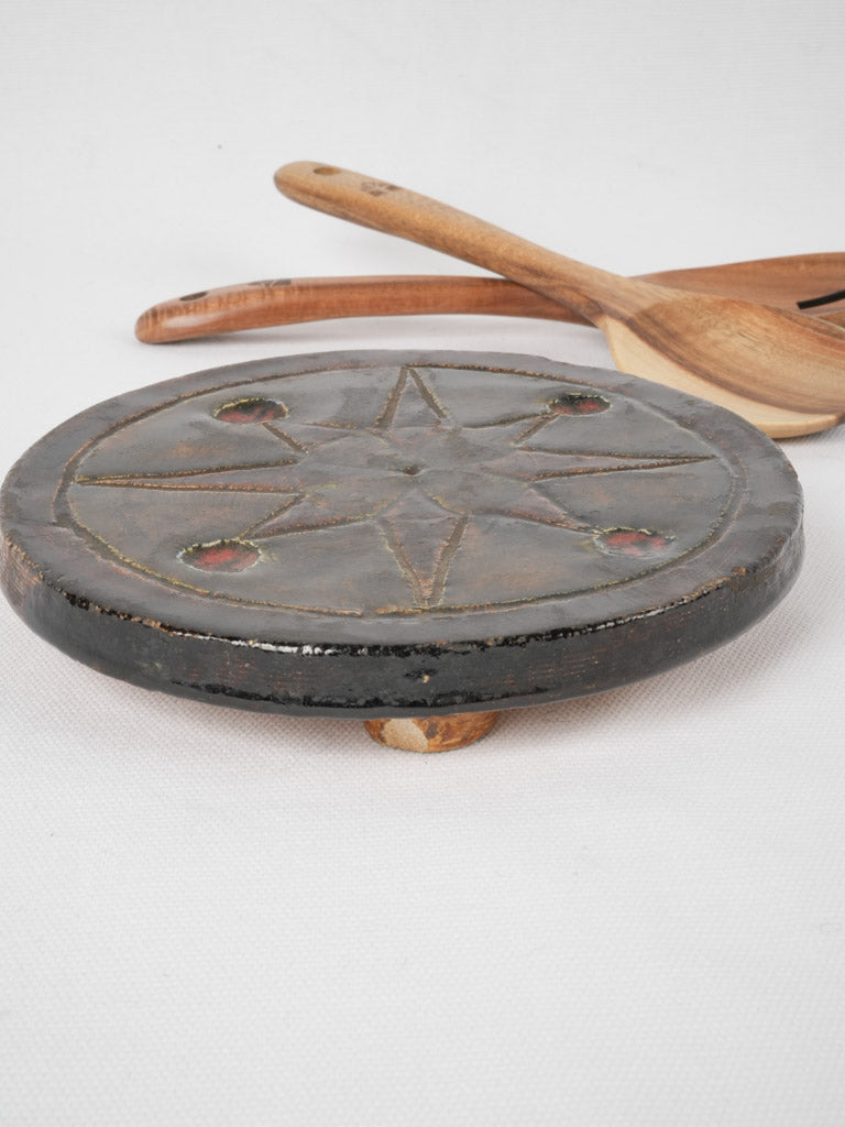 Vintage terracotta star-decorated trivet