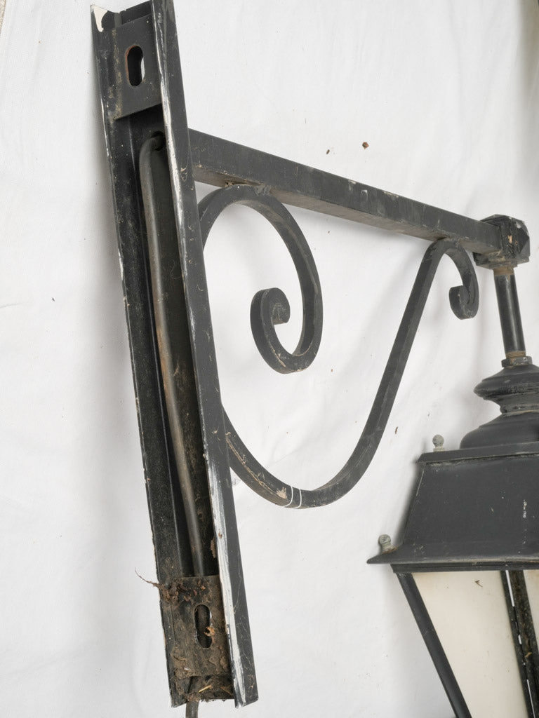 Scrolled wrought iron village wall lights