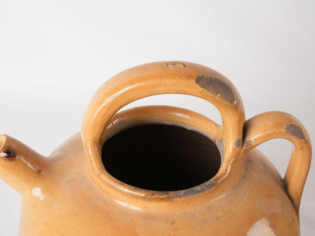 Aged beige-glazed terracotta cruche