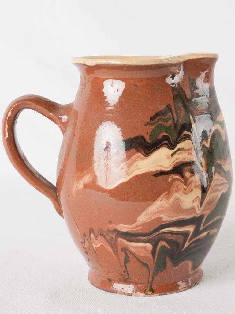 Early 20th-century green swirl pitcher