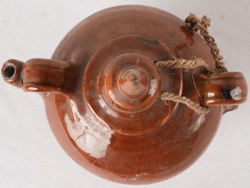 Aged earthen jug with original lid