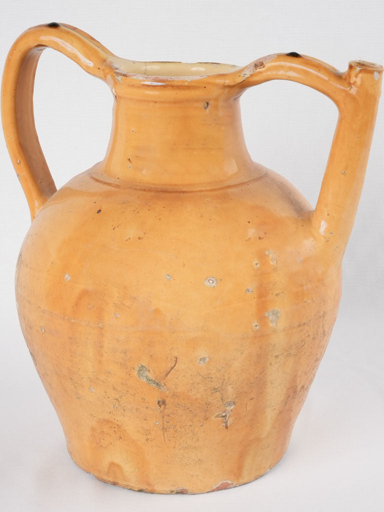 Antique French earthenware yellow-ocher pitcher