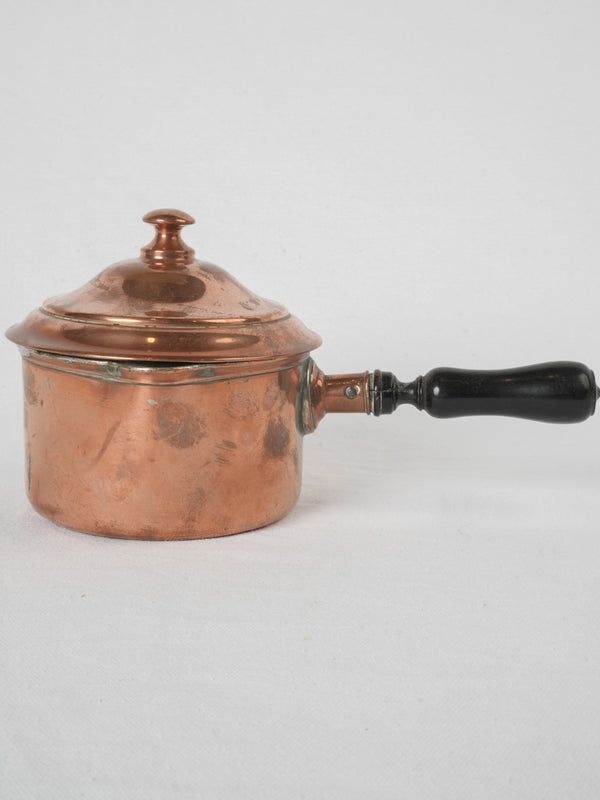 Elegant vintage copper saucepan with pourer