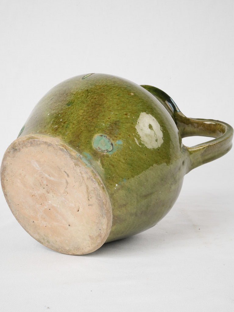 Time-worn green glazed water ewer