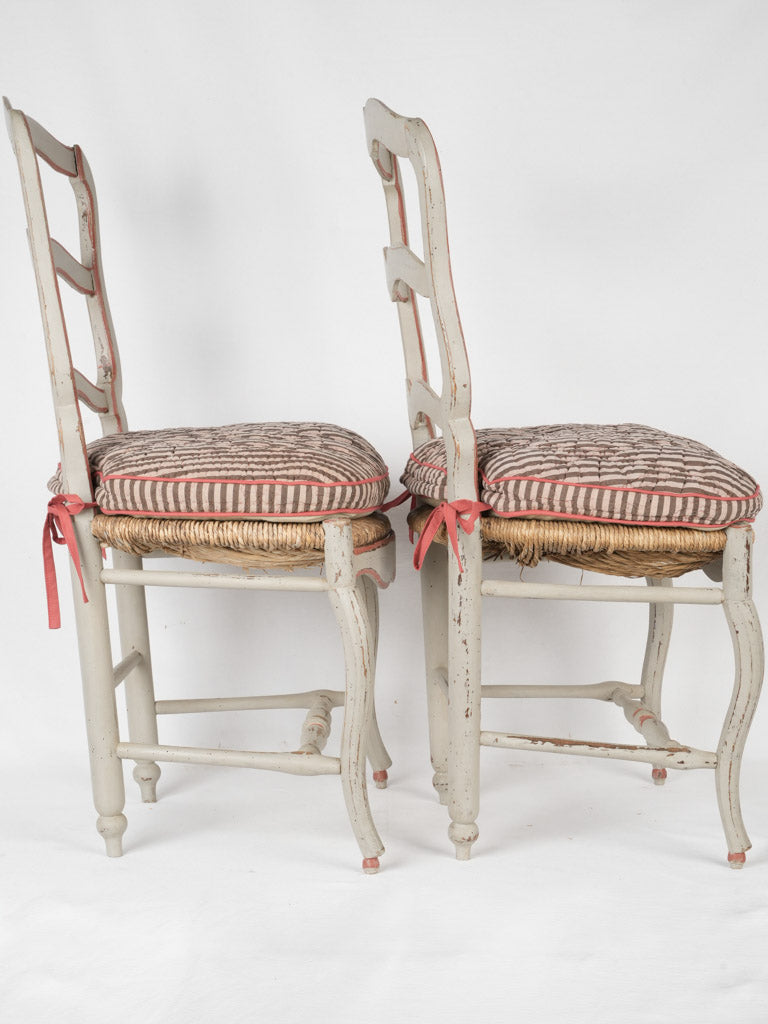 Rustic terracotta-trimmed ladderback chairs