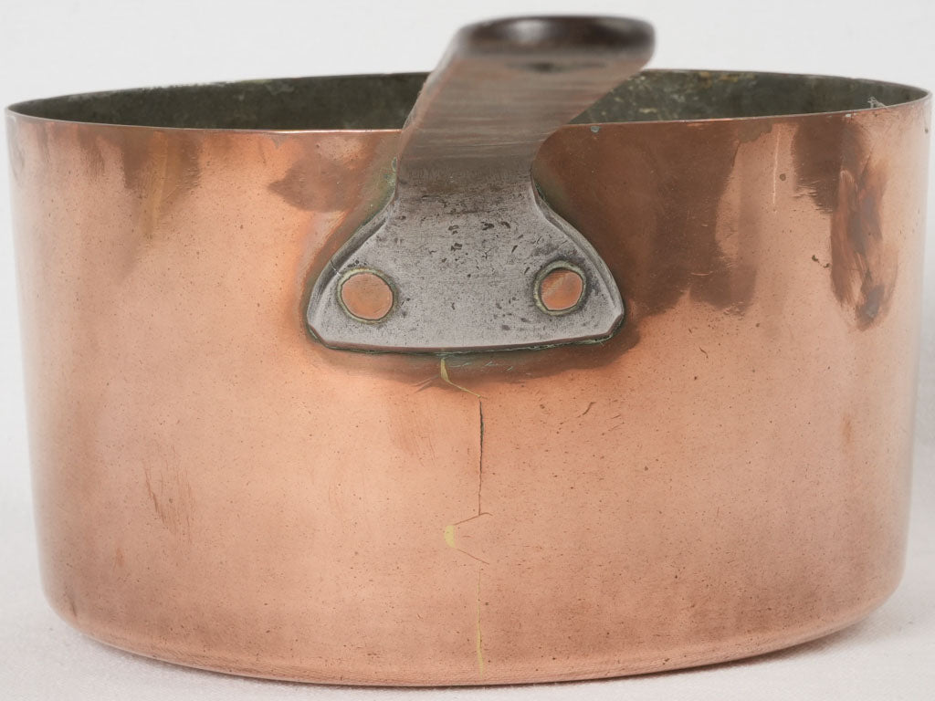 Quality crafted 19th-century copper saucepan with iron handle