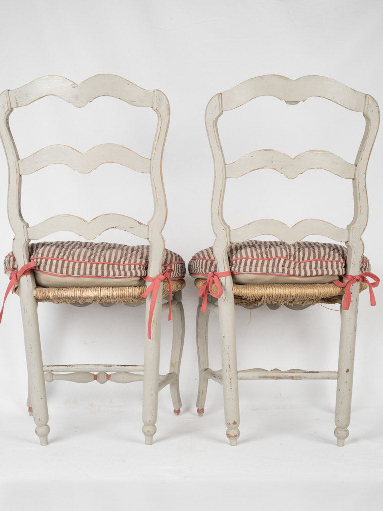 Salvaged fabric cushioned dining chairs