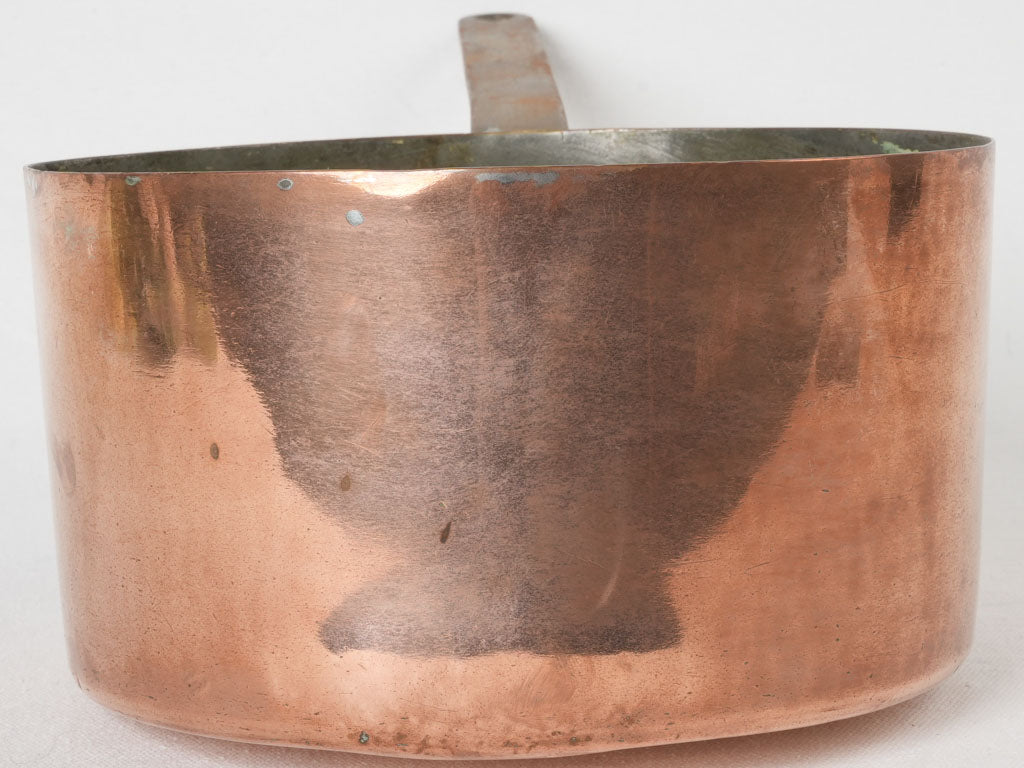 Classic copper cookware with antique iron handle