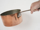 Artisanal wrought-iron handled copper French saucepan