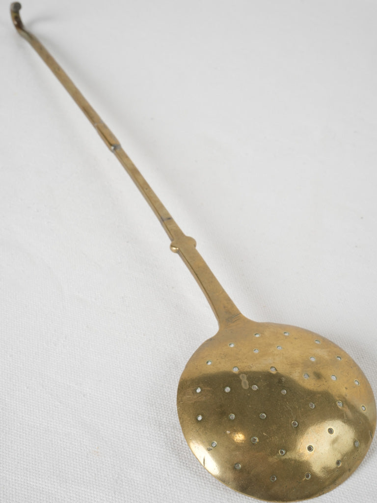 Durable long-handled brass spoon 