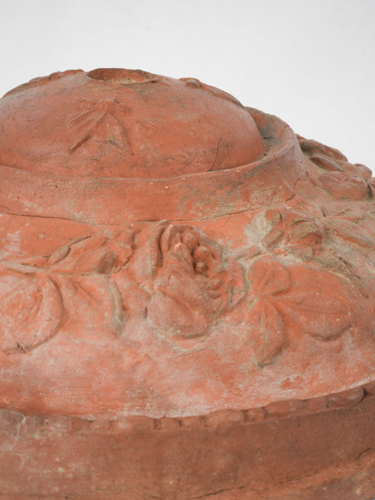 Time-worn elegant terracotta plant holder