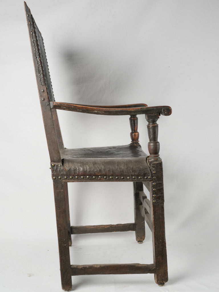 Intricate, carved, wooden armchair